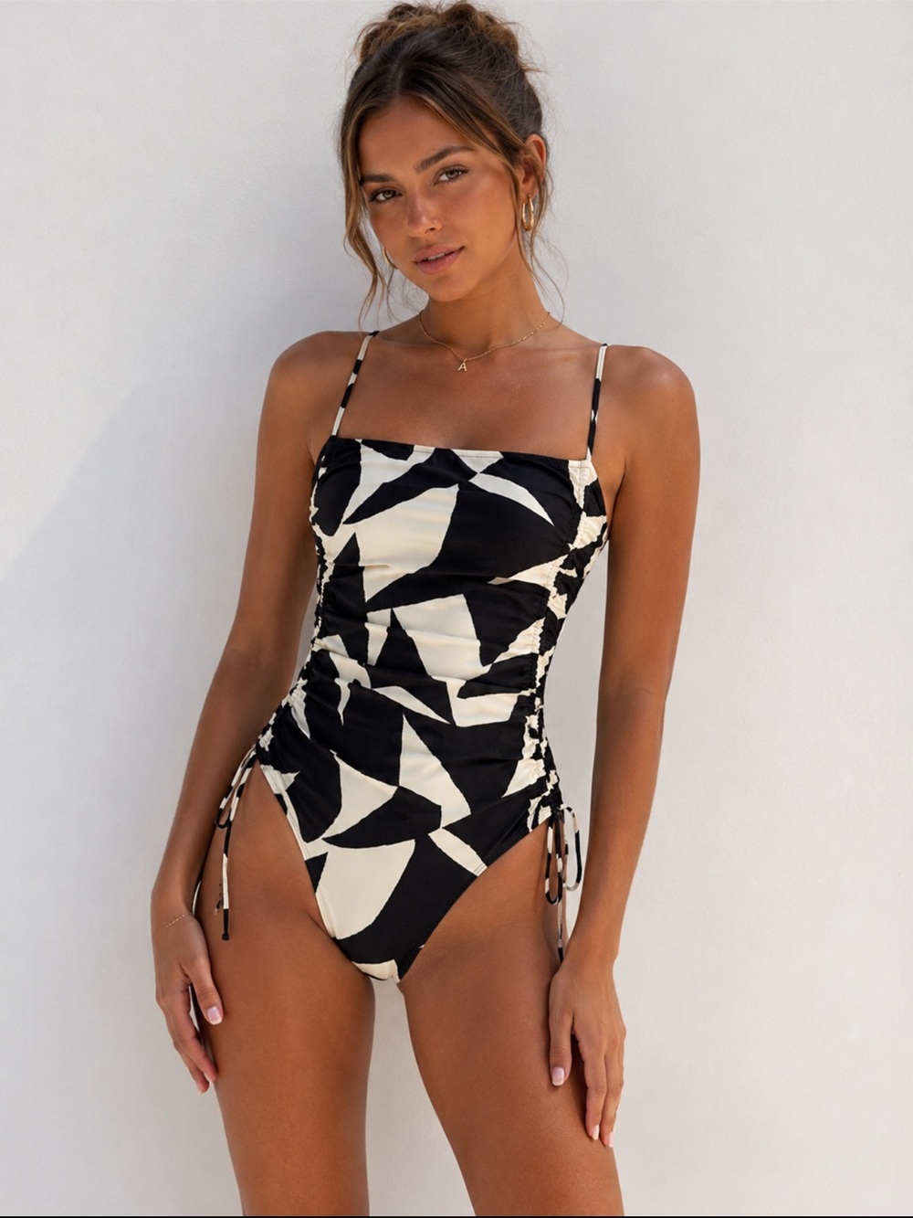 H&M Black and Cream Abstract One-Piece Bodysuit
